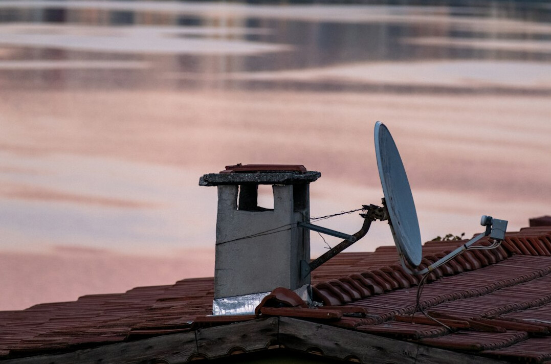 Outside broadcast van with satellite dish on location